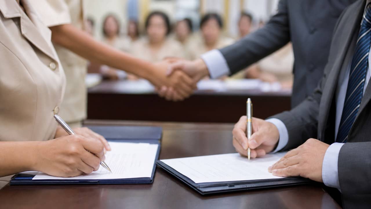 Documents being signed at a social security support meeting for education workers