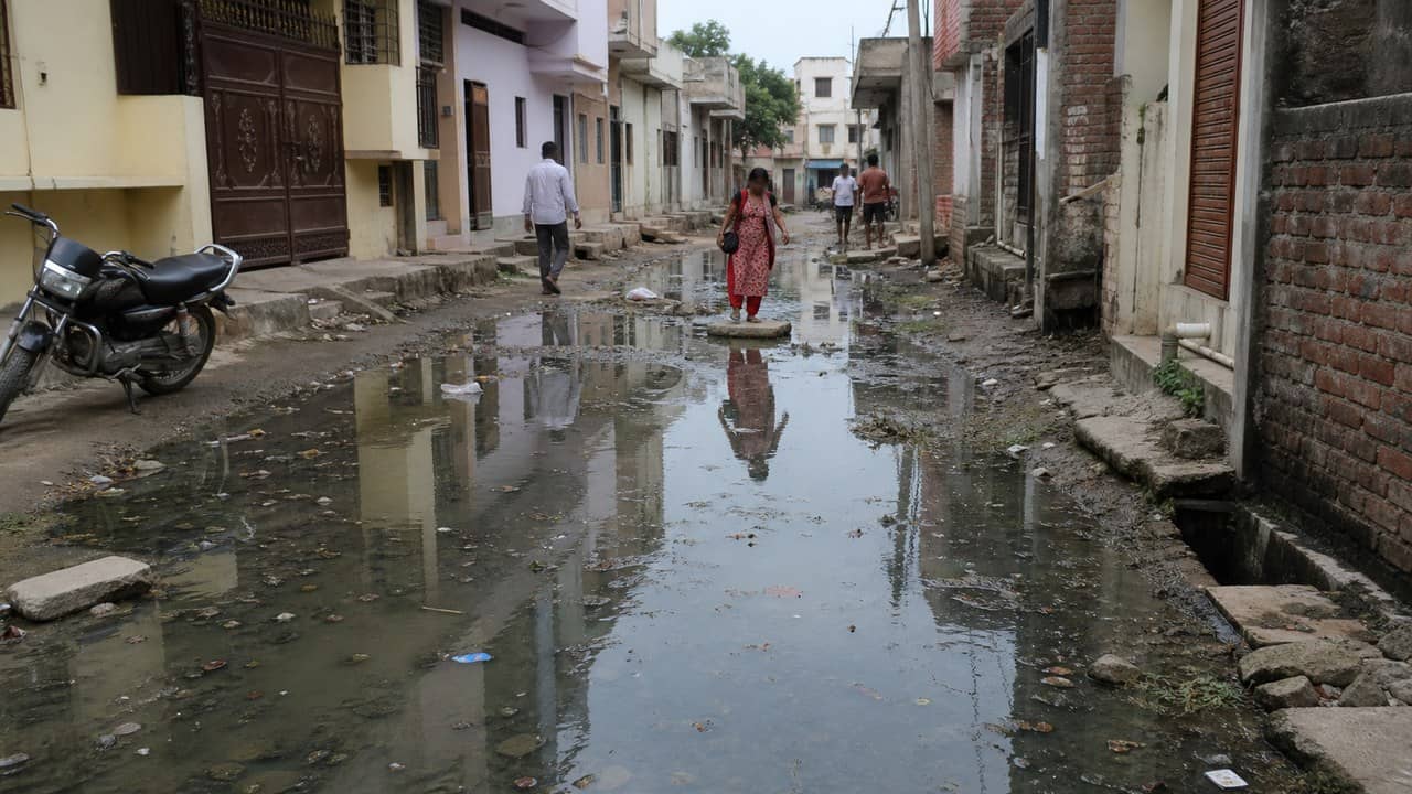 Waterlogged residential lane in Madouli area of Varanasi showing drainage problems
