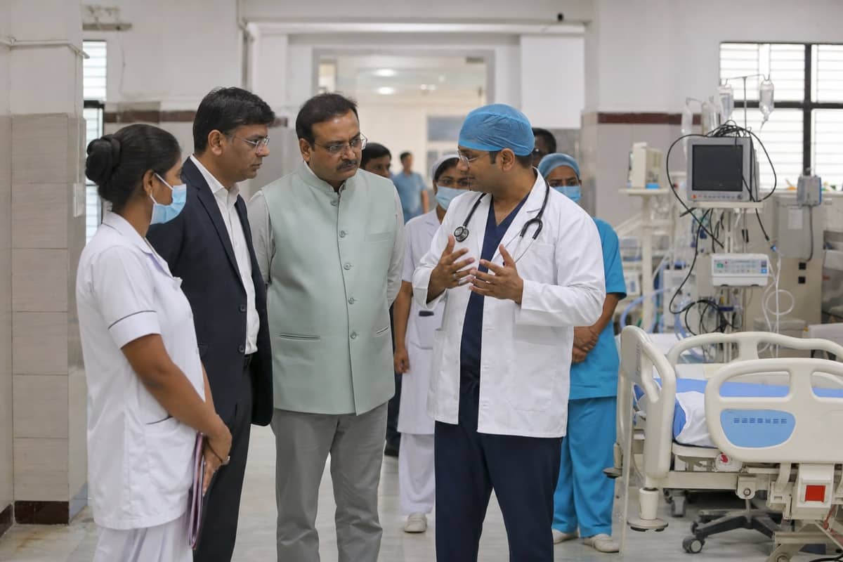 Doctors and officials inspecting a government hospital ward in Varanasi during an infrastructure review
