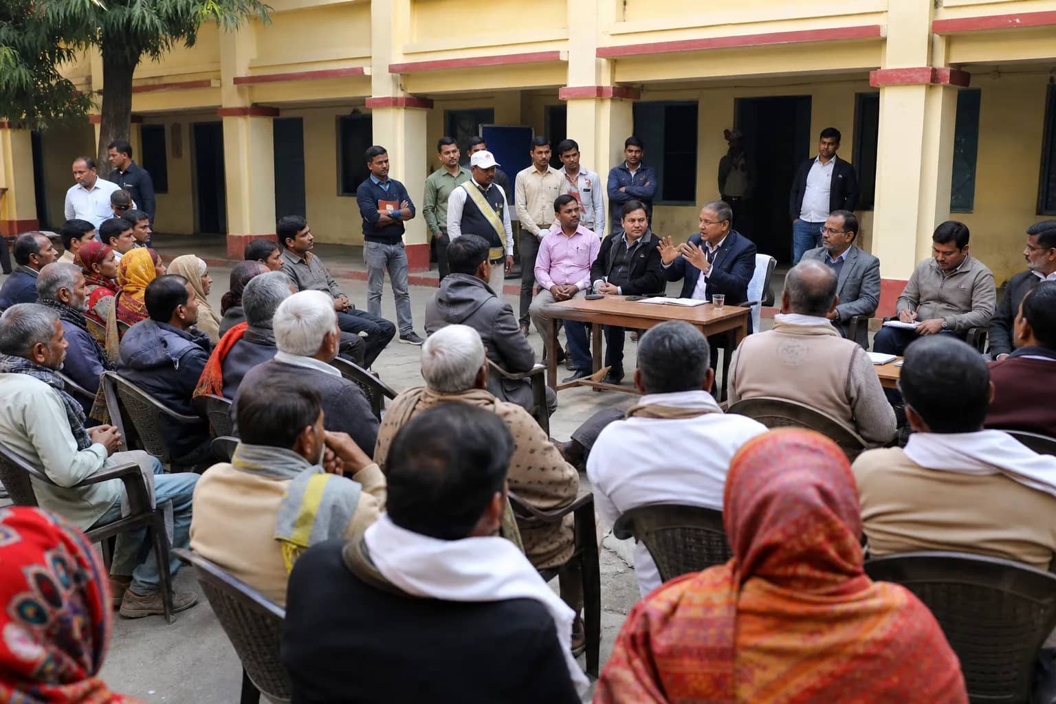 Representative civic outreach meeting in a Varanasi school courtyard