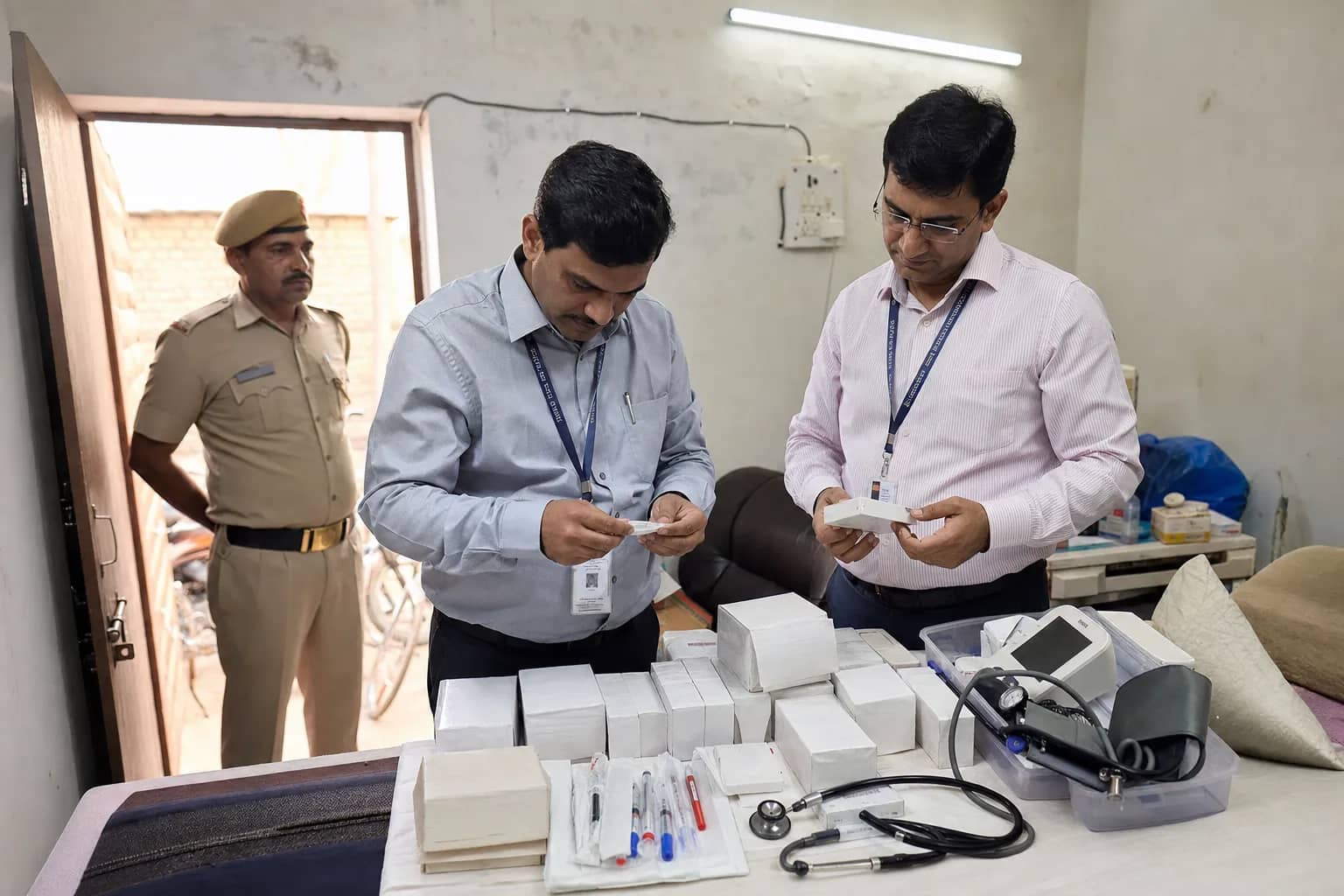 Health officials inspecting medicines inside an unregistered clinic in Gurugram