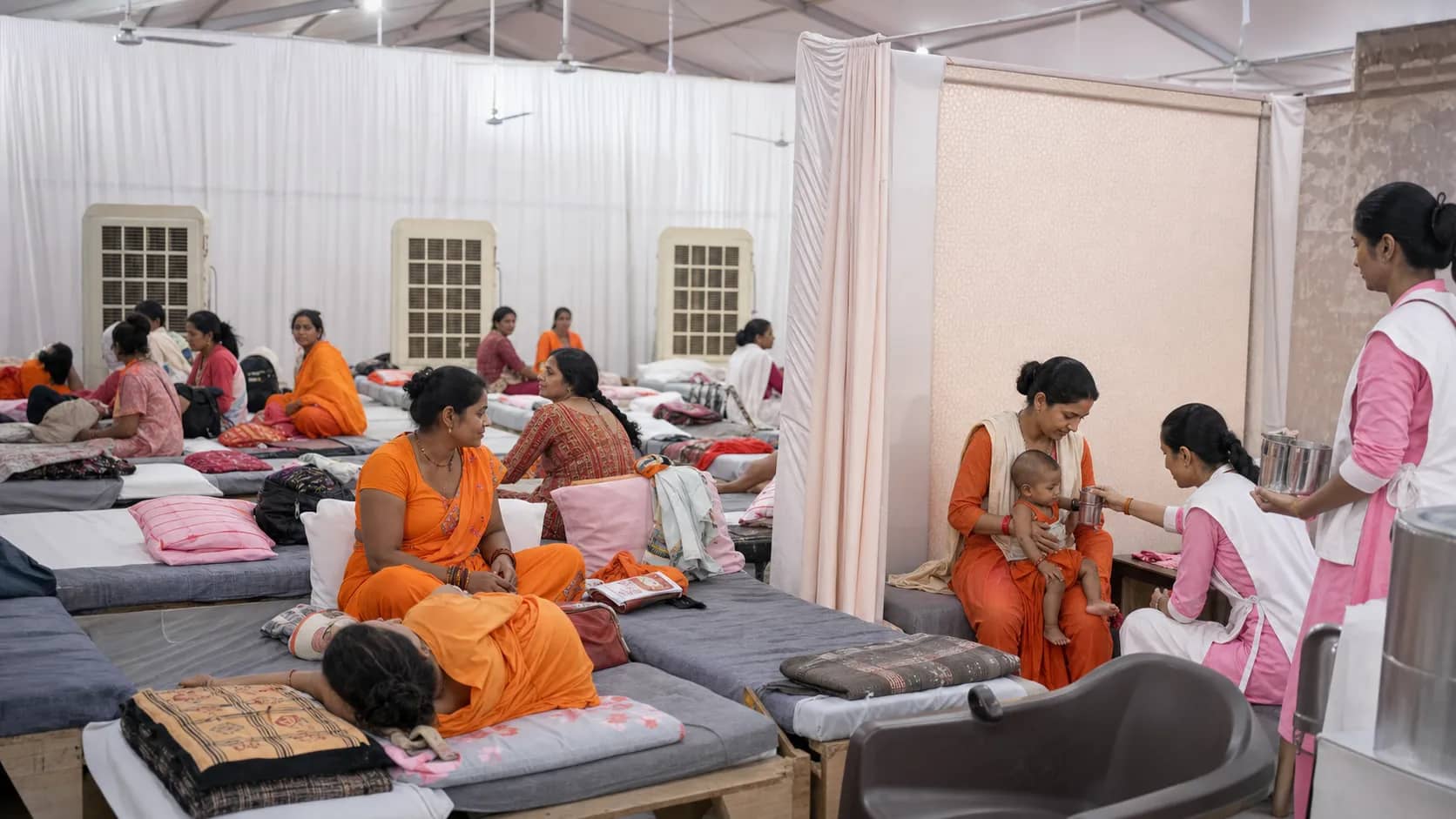 Women pilgrims resting safely at a clean temporary camp in Varanasi during Shravan