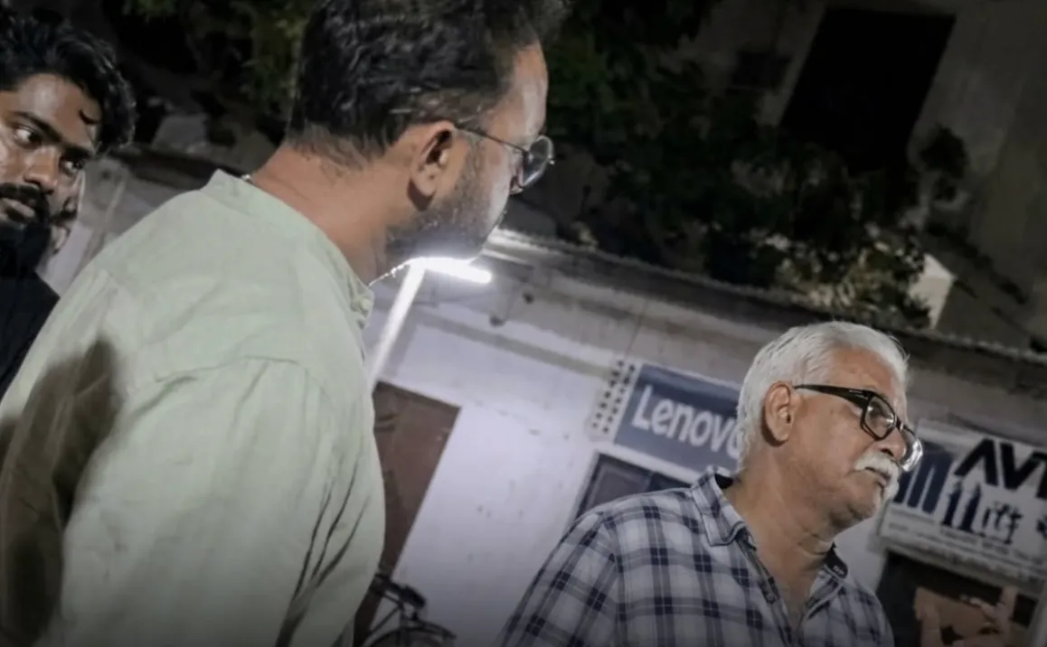 Varanasi Cyber Crime Cell officers standing with seized computer hardware and laptops following a raid on a fake call center