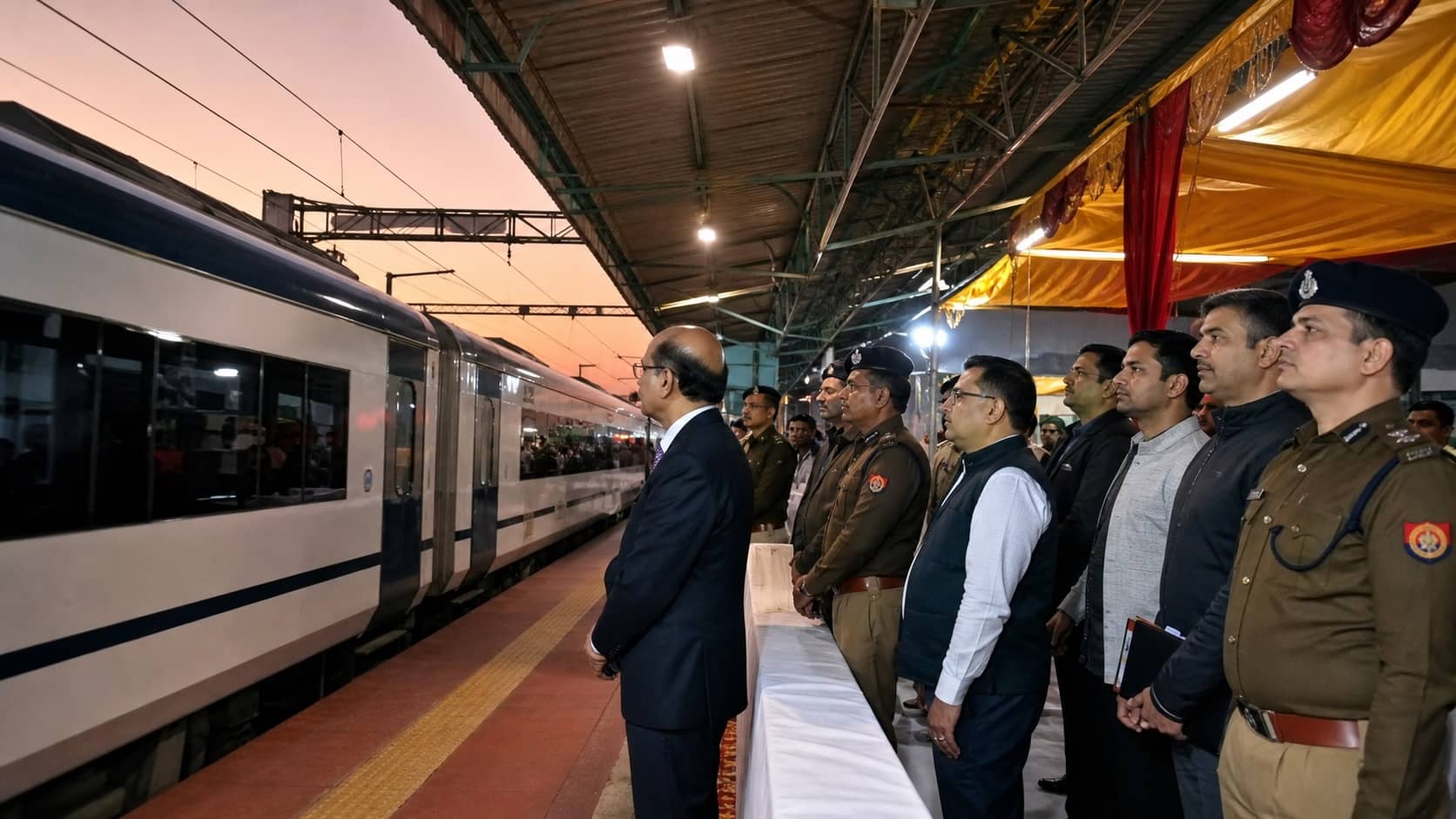 Vande Bharat train arriving at Varanasi Cantt station as officials wait on the platform