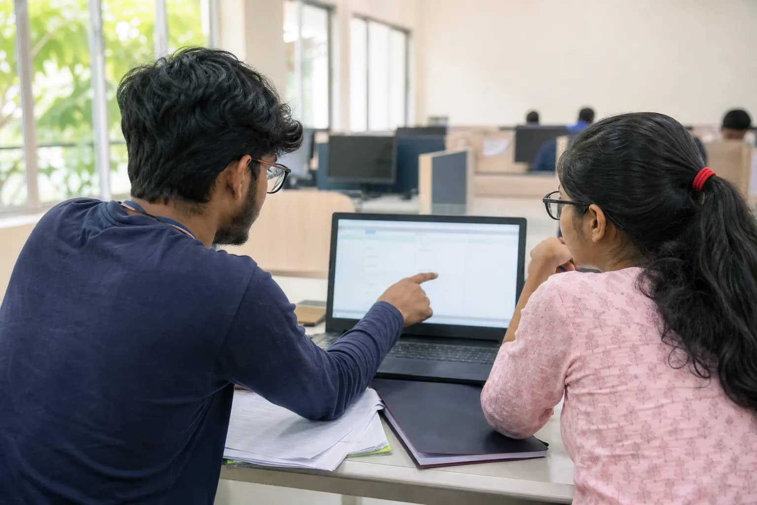 Medical admission candidates checking a counselling allotment on laptops