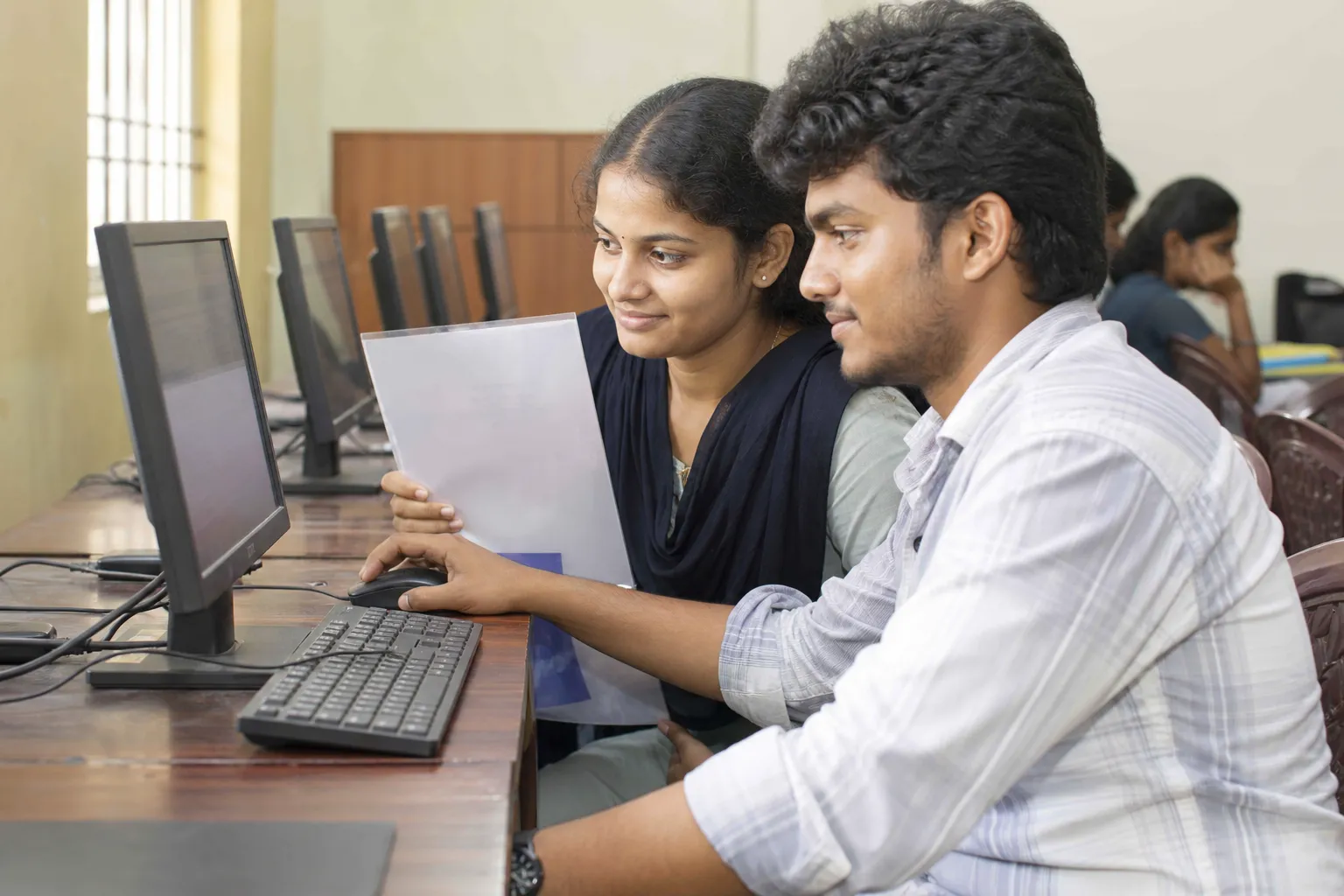 Engineering applicants checking a seat allotment at a computer lab
