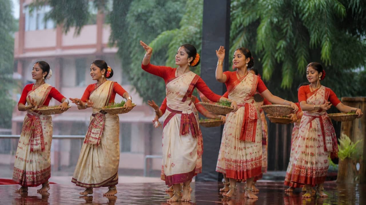 College students performing a monsoon folk dance on stage