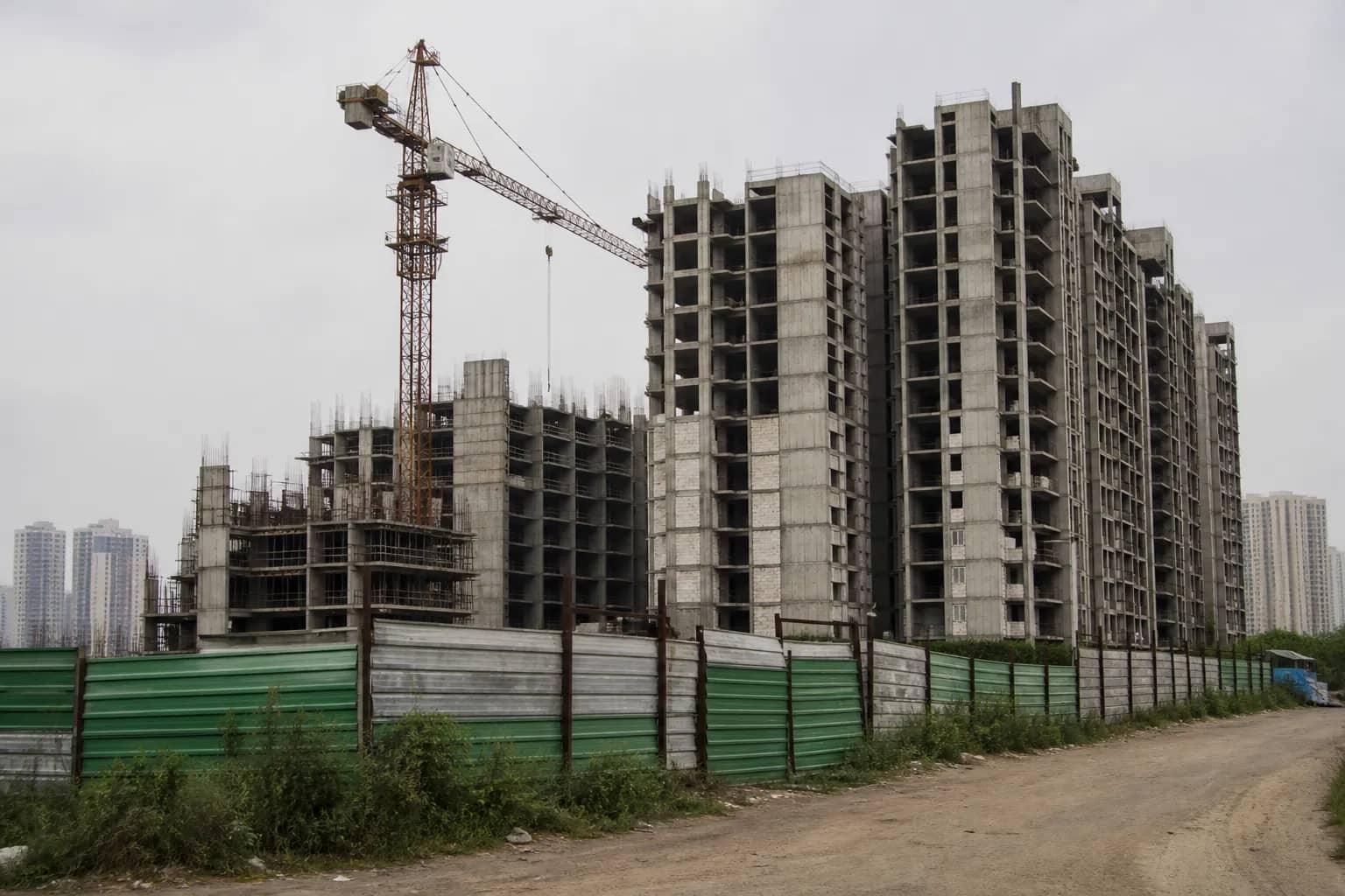 Partly built housing towers at a stalled construction site in Sector 69 Gurugram