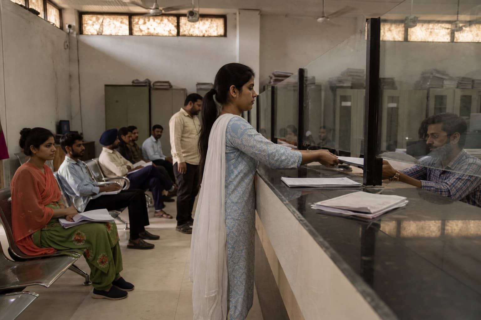 Representational illustration of a Punjab admissions counter with an in-person file handover