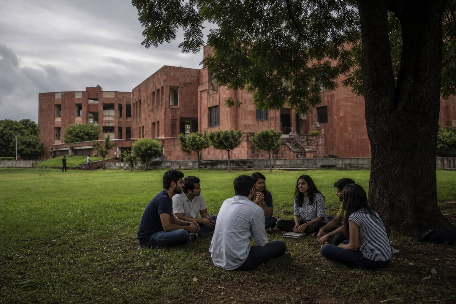 Representational illustration of a JNU admissions desk with a vacant-seat notice and an application login screen