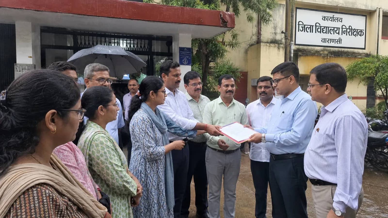 Teachers submitting a memorandum at an education office in Varanasi