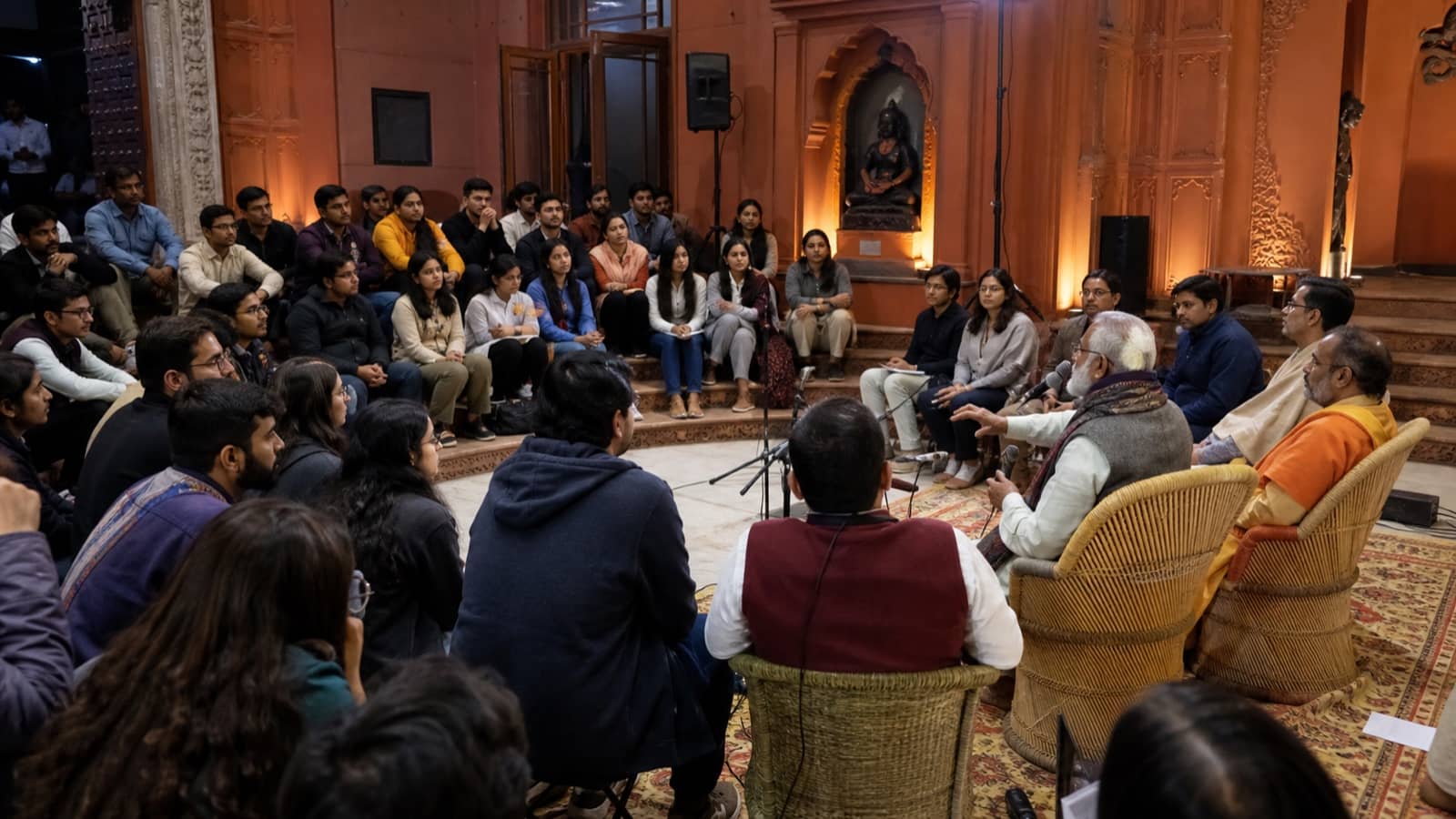 Students attending a youth and education dialogue in a traditional Varanasi hall