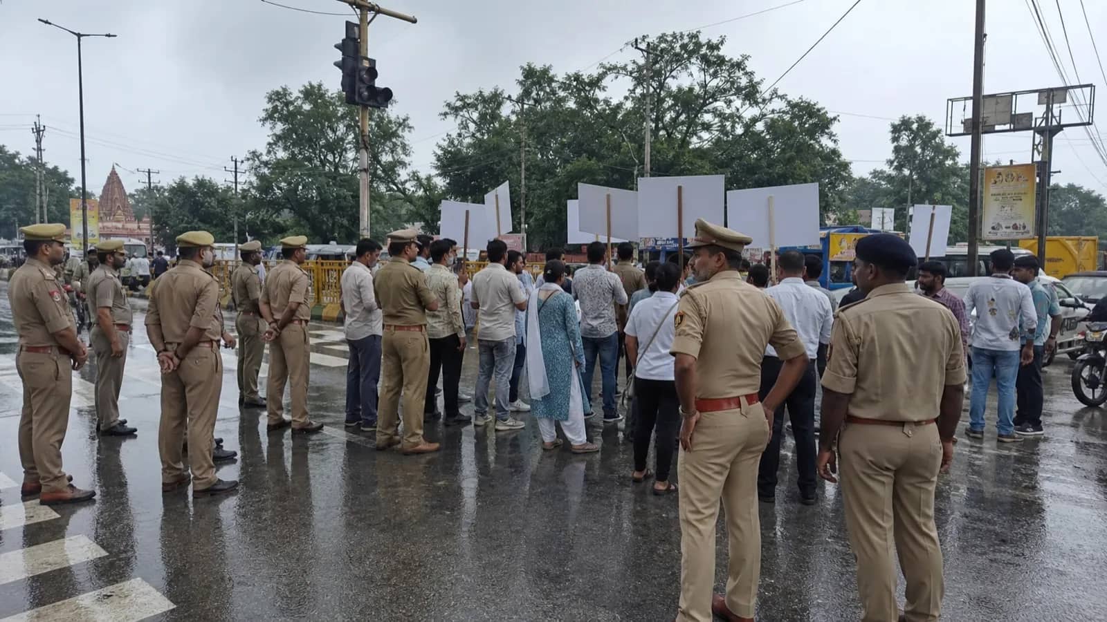 A peaceful protest march meeting a police line at a Varanasi junction