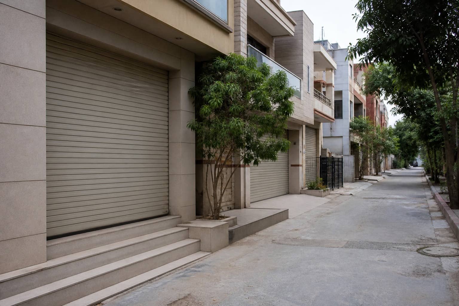 Enforcement team and machinery outside a Gurugram licensed colony