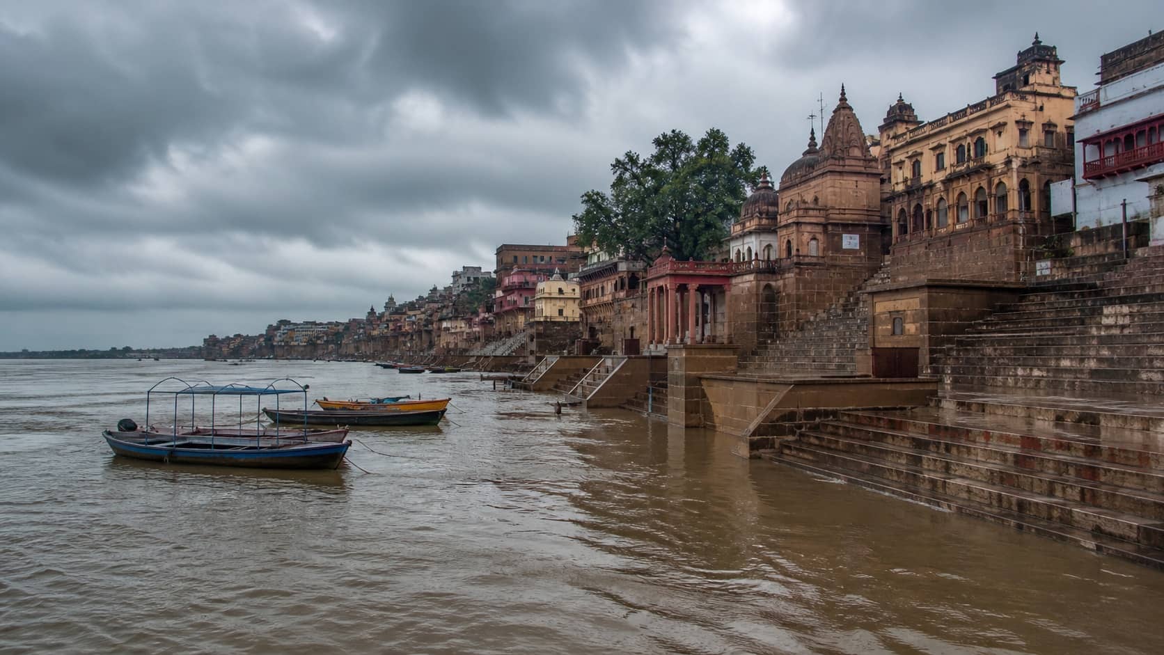 Rising Ganga water close to lower steps of Varanasi ghats