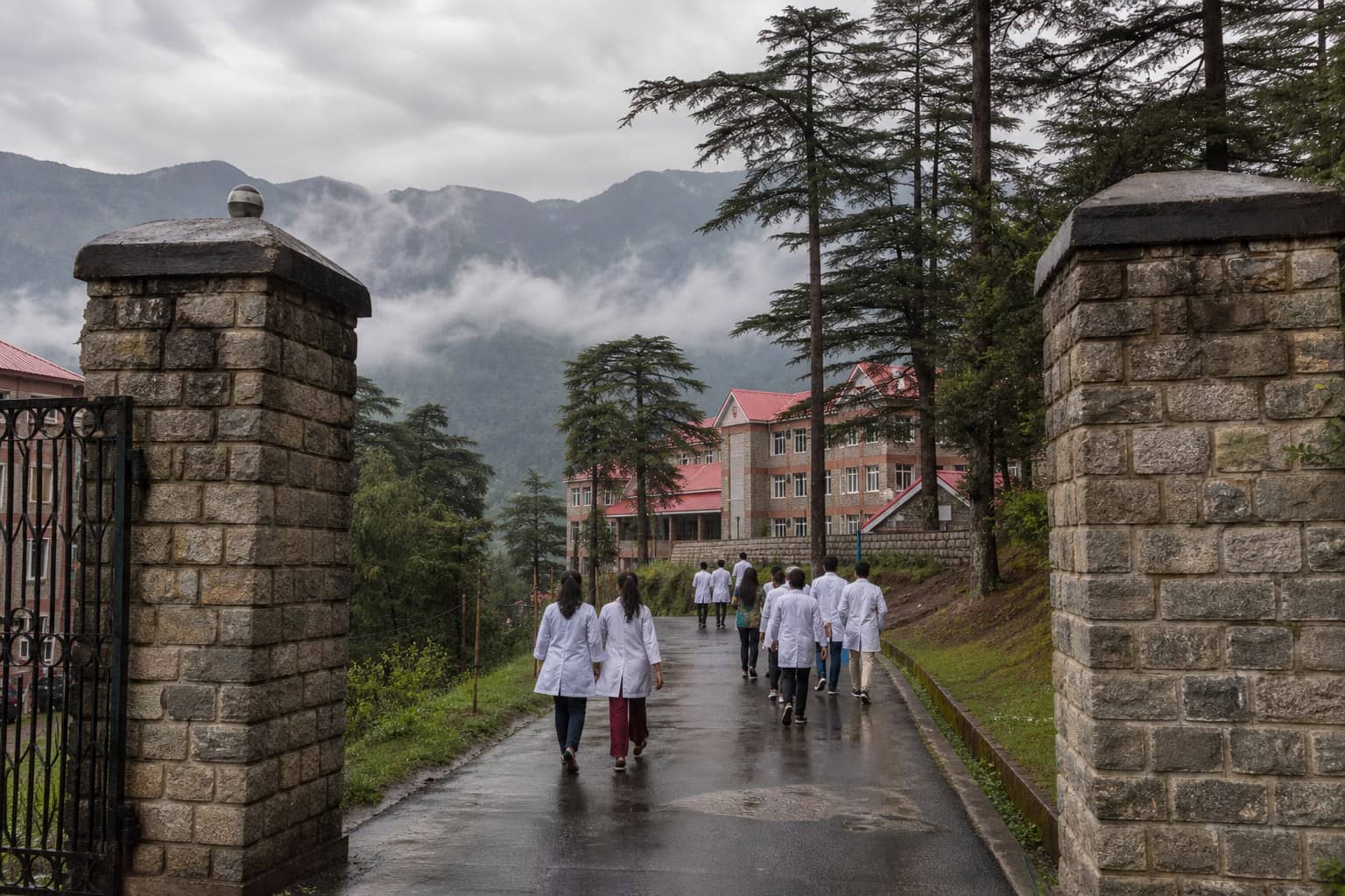 Representational illustration of a Himachal hill medical campus gate with unmarked allotment envelopes