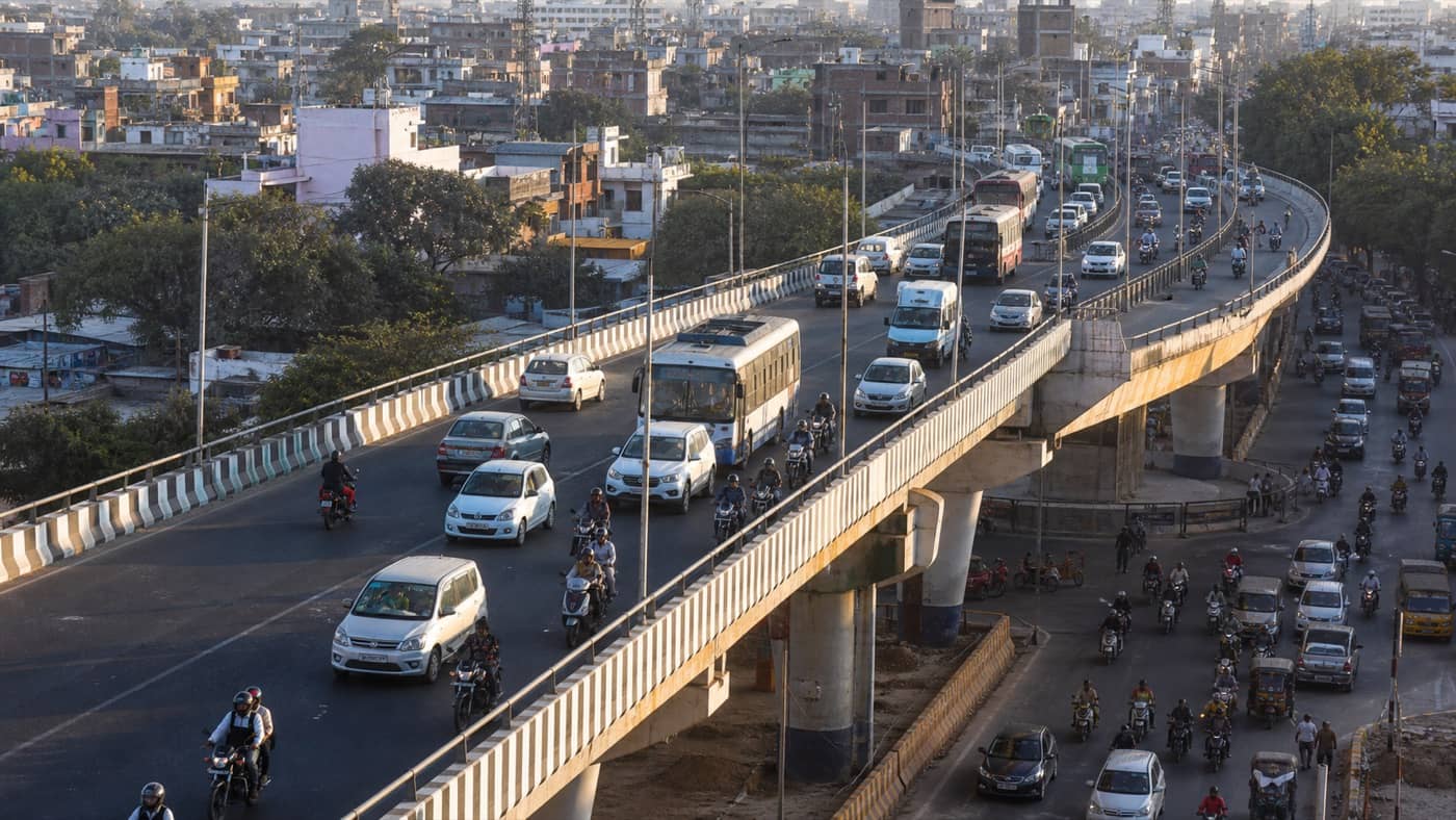 Busy urban overbridge carrying cars and motorcycles in Varanasi