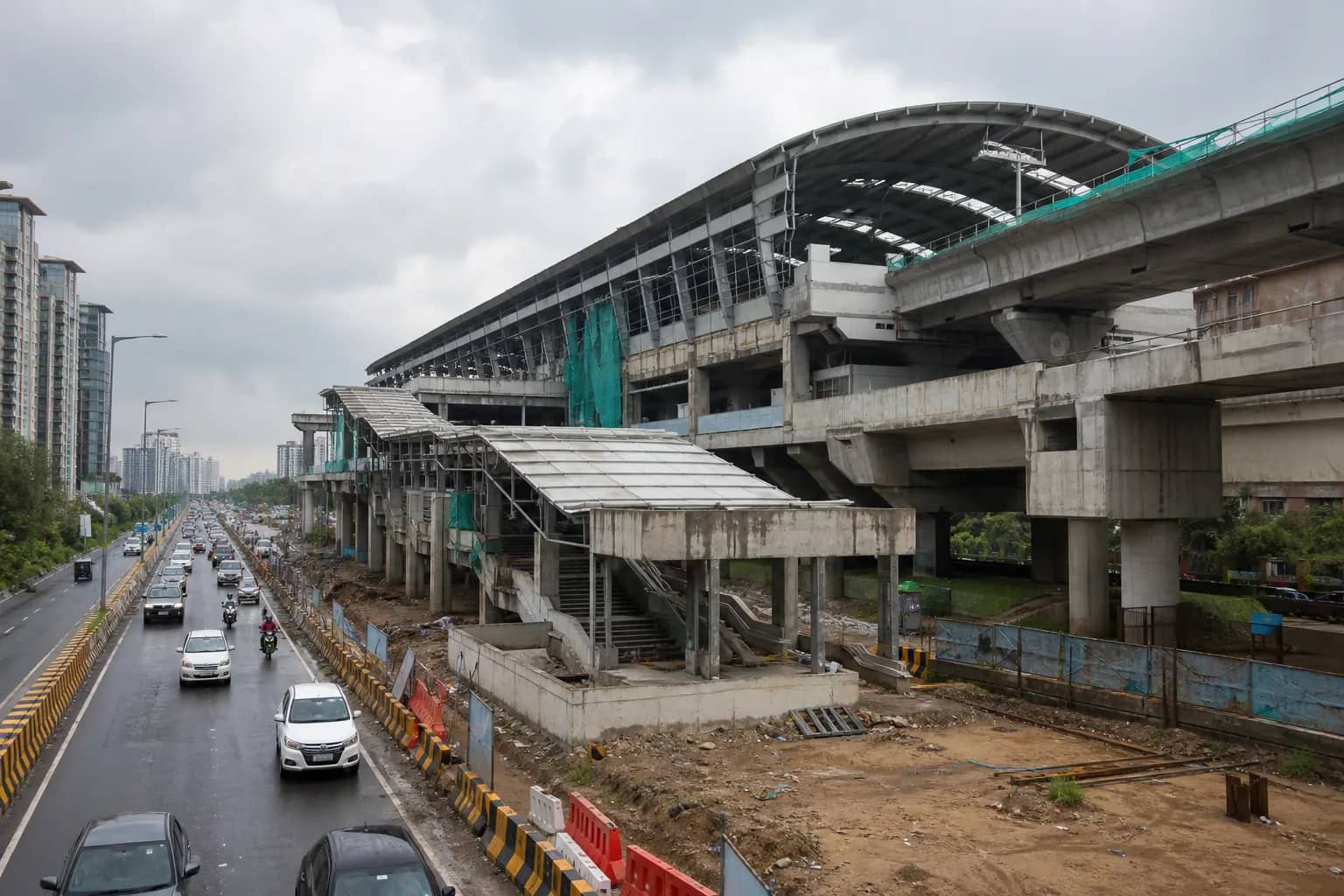 Elevated Gurugram Metro station construction beside a busy city road