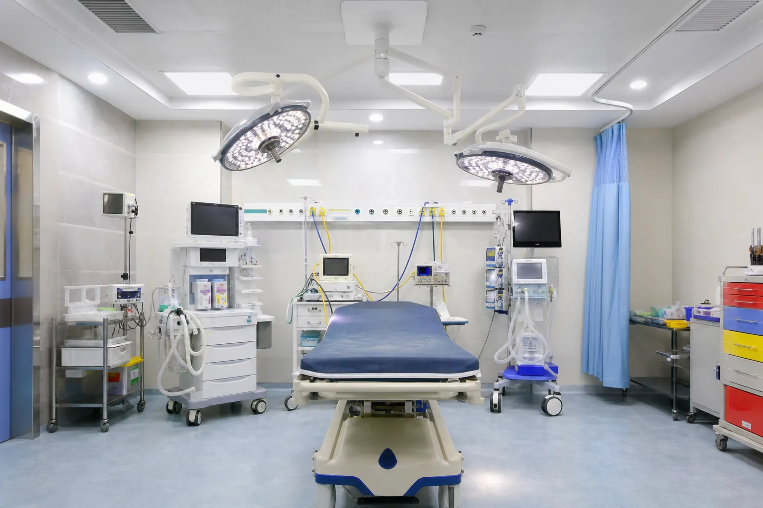Modern emergency treatment room being prepared inside a public hospital