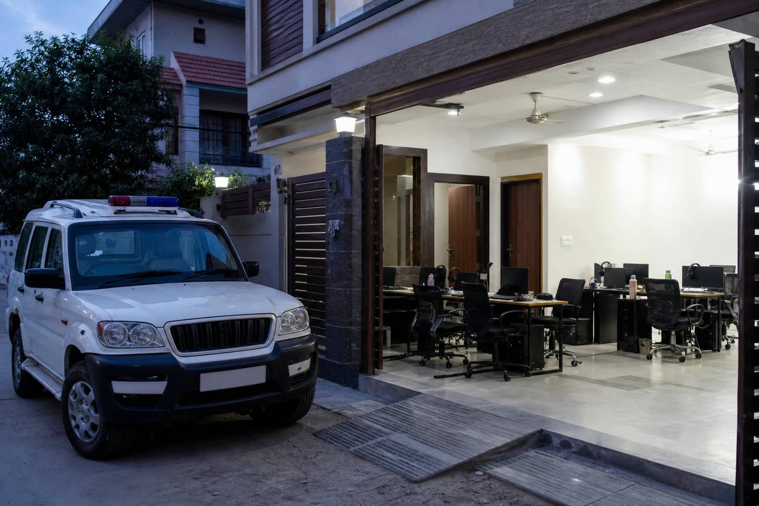 Police outside a residential building used as an alleged call centre in Gurugram