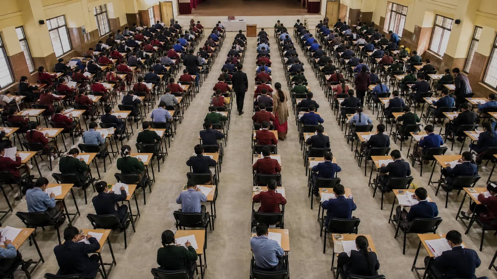Students seated for a large general-knowledge examination in Varanasi