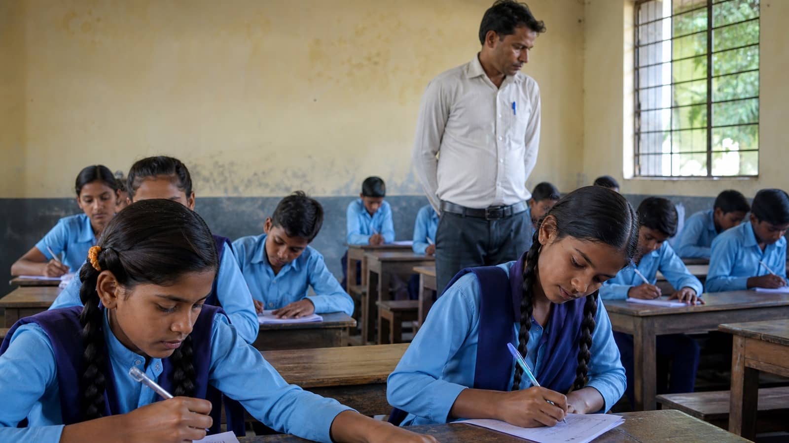 School students taking part in a written quiz in rural Varanasi
