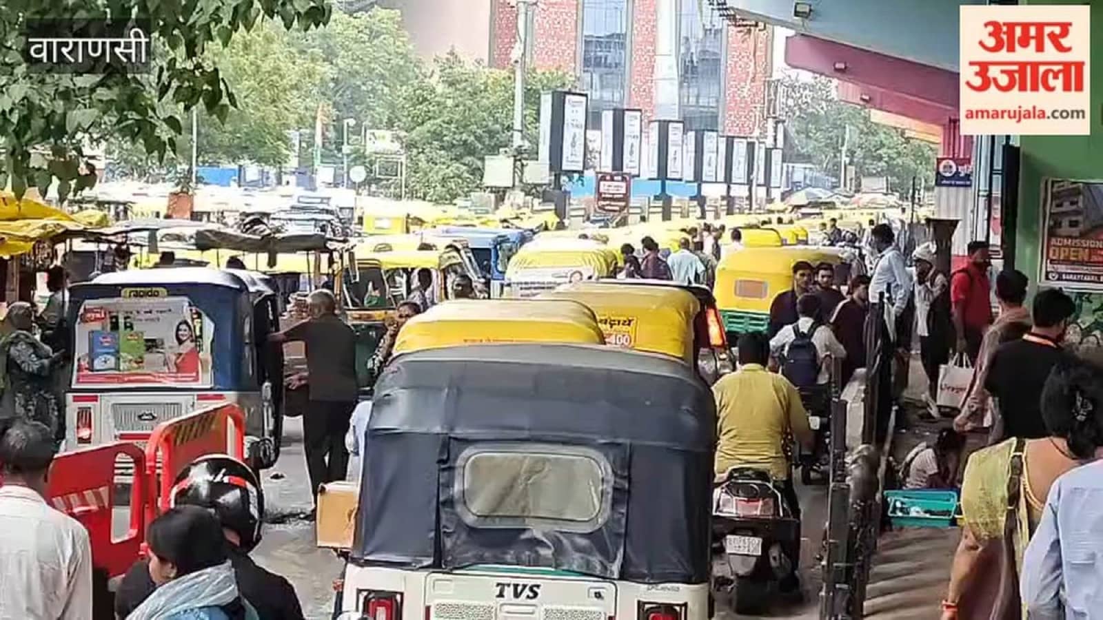 Dense auto-rickshaw traffic outside Varanasi Cantt railway station