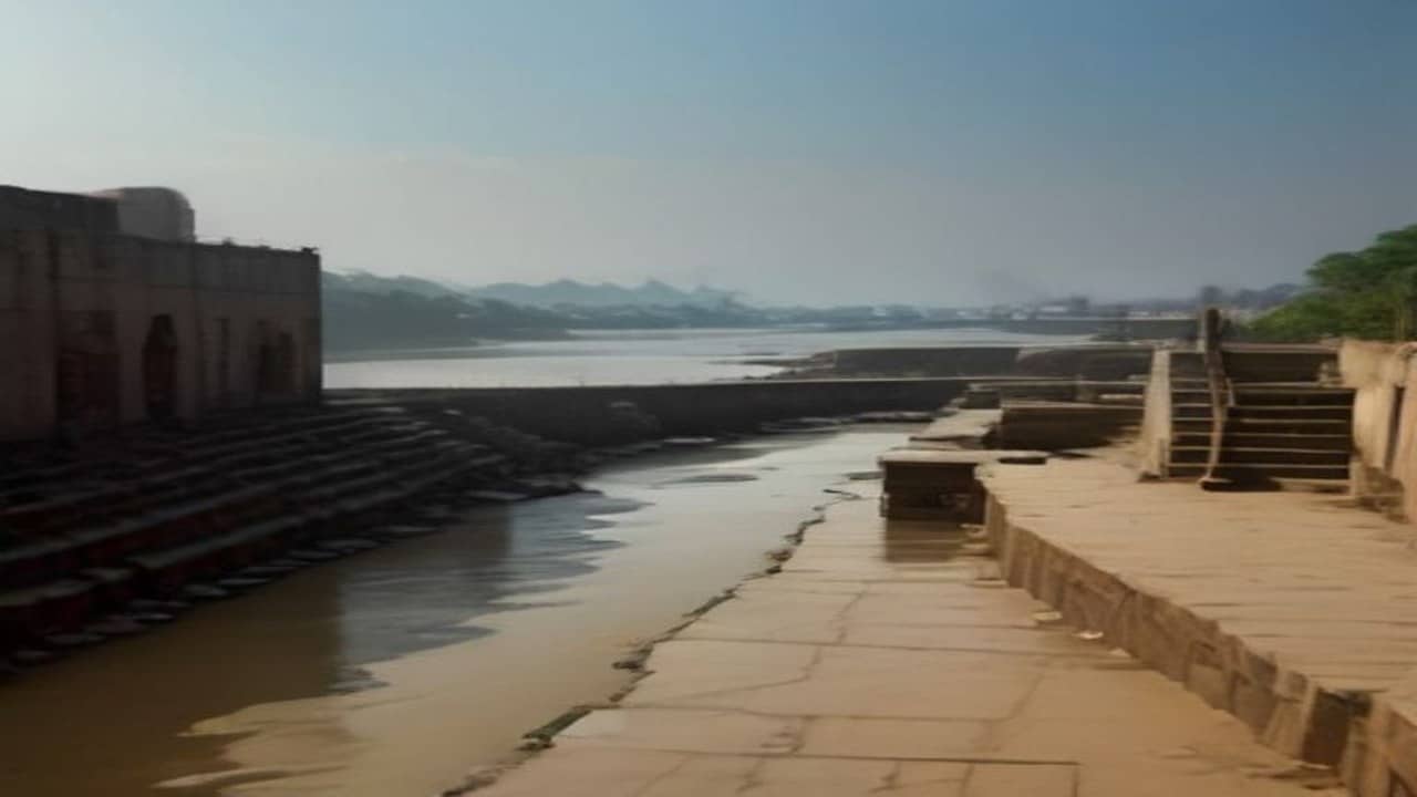 Empty silty stone ghat steps coated with drying mud and debris after floodwater receded, wide river haze in background, no people, no readable signs