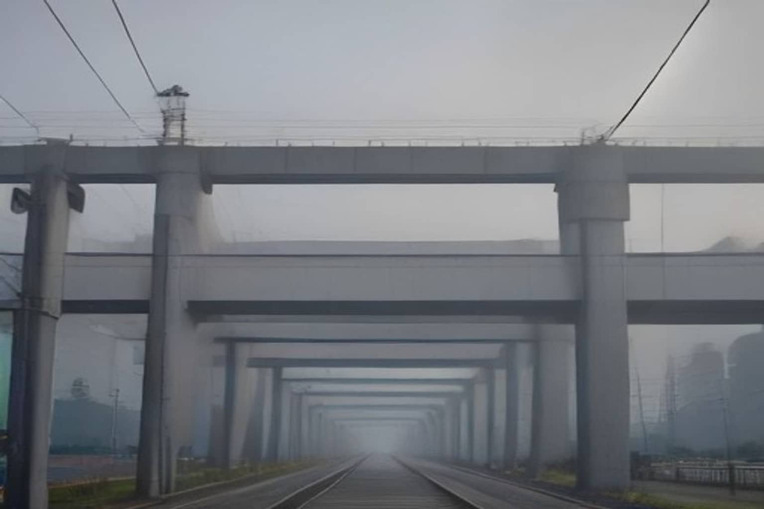 High-tension power lines along a Gurugram highway metro corridor