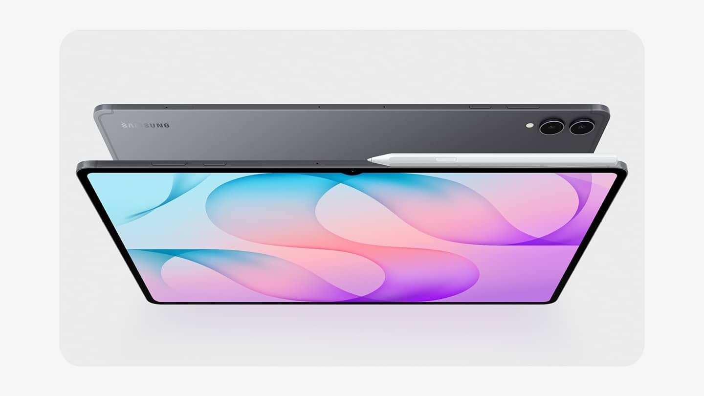 Two Samsung Galaxy Tab S12 series tablets in grey, one showing its pink and blue wave screen and one showing its back with the dual camera, with a white S Pen resting on top, on a light grey backgrou…