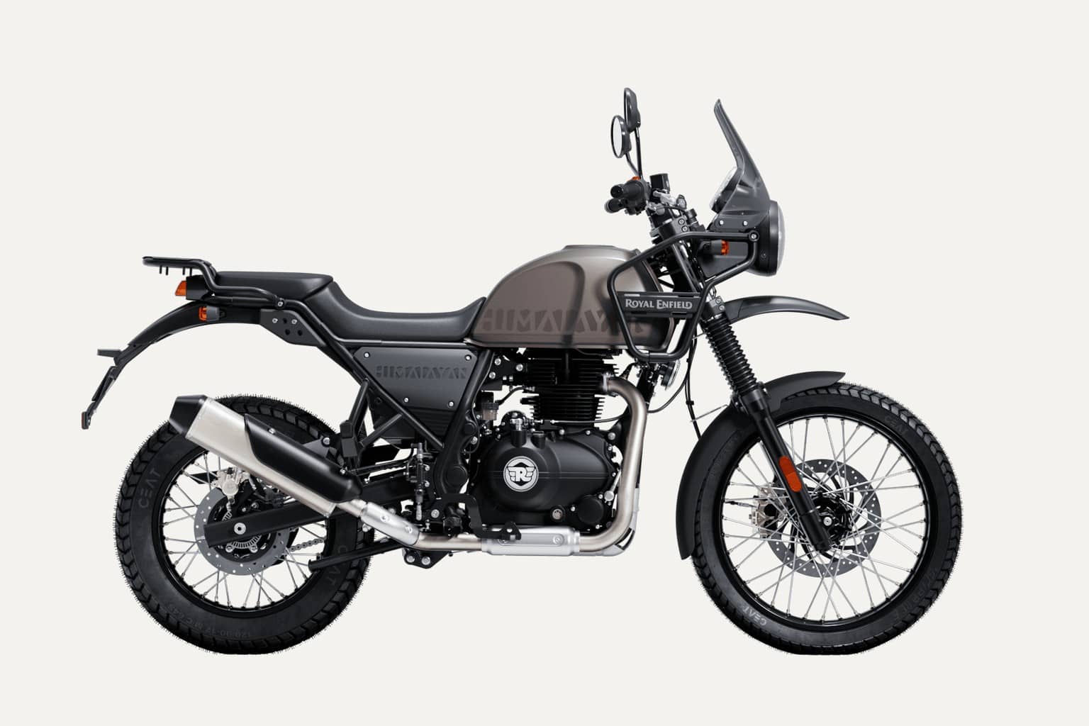 Royal Enfield Himalayan 440 adventure motorcycle in a dark brown and black finish, side view on a plain light background