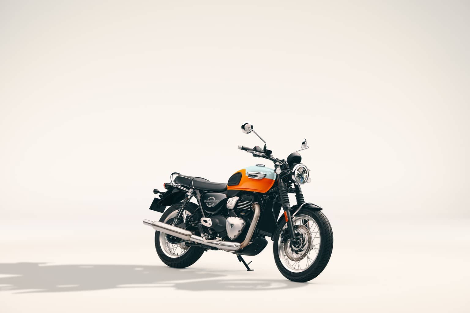 Triumph Bonneville T40 motorcycle with an orange and white tank, side view on a plain light background