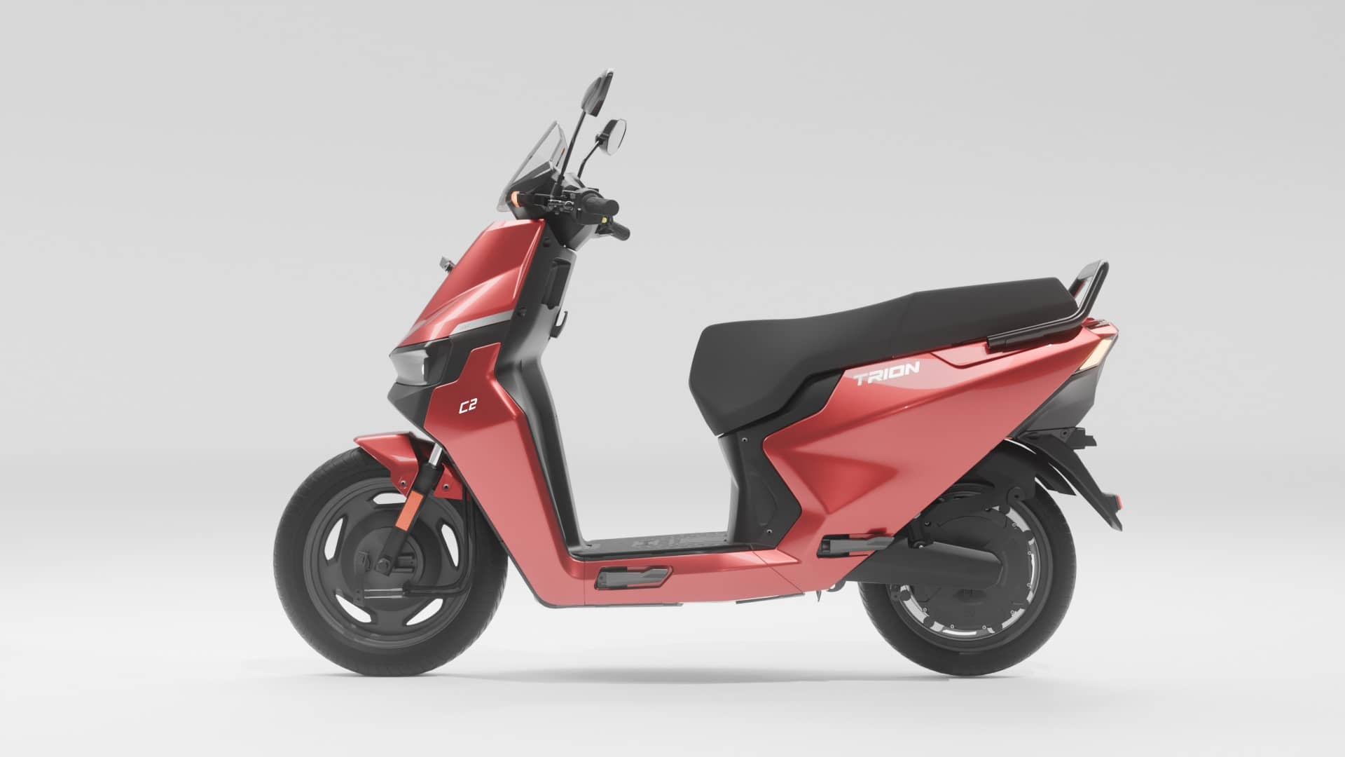 E3 Trion C2 electric scooter in red with black seat, side view on a plain light grey background