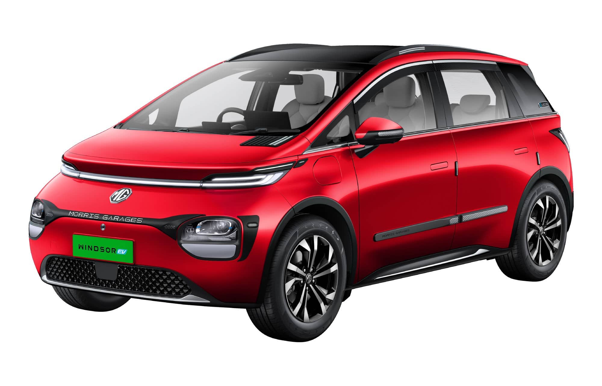 Red MG Windsor EV electric crossover with black roof and green number plate, front three-quarter view on a white background
