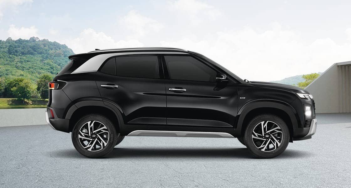 Hyundai Creta SUV in black, side view, parked outdoors under a clear sky