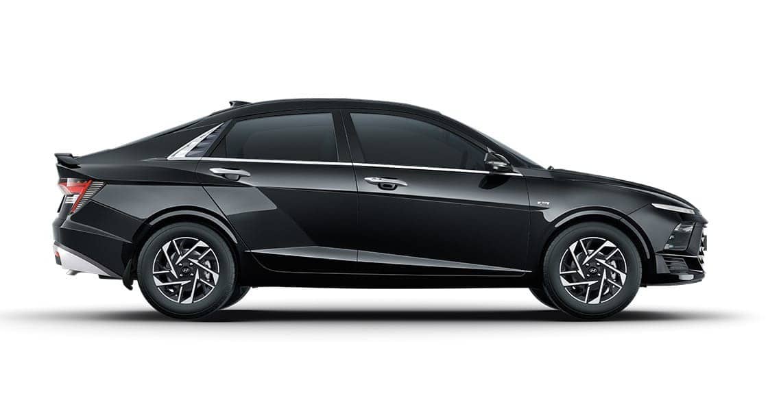 Hyundai Verna sedan in black, side view on a plain white background
