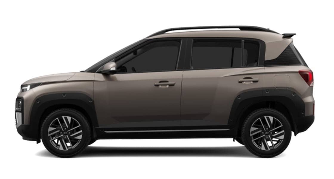 Hyundai Exter compact SUV in beige and black dual-tone, side view on a plain white background
