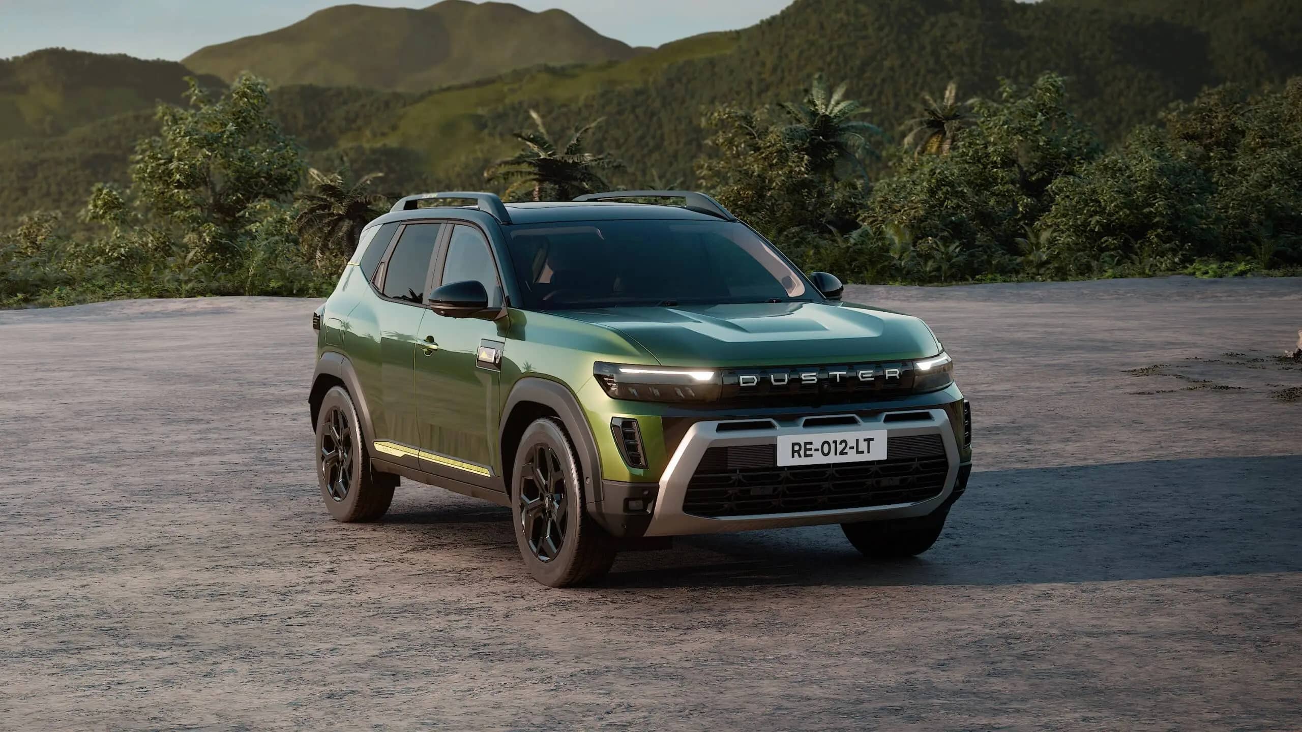 Green Renault Duster seen from the front and side on a paved clearing, with trees and hills behind it