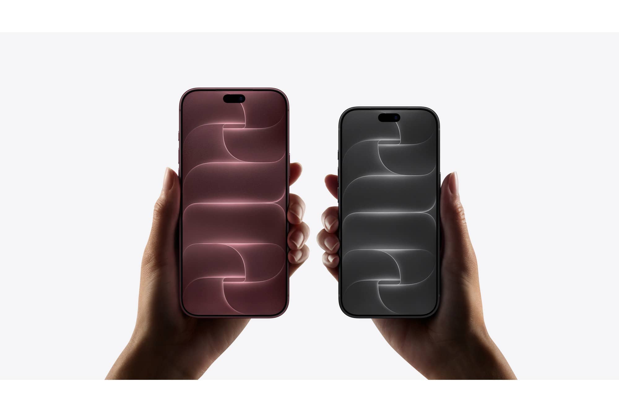 Two hands holding Apple iPhone 18 Pro phones in two colours, screens facing out