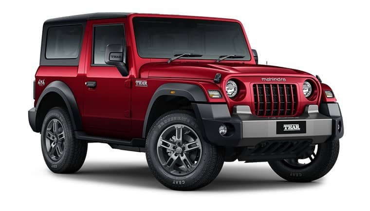 Red Mahindra Thar OG three-door SUV seen from the front three-quarter angle