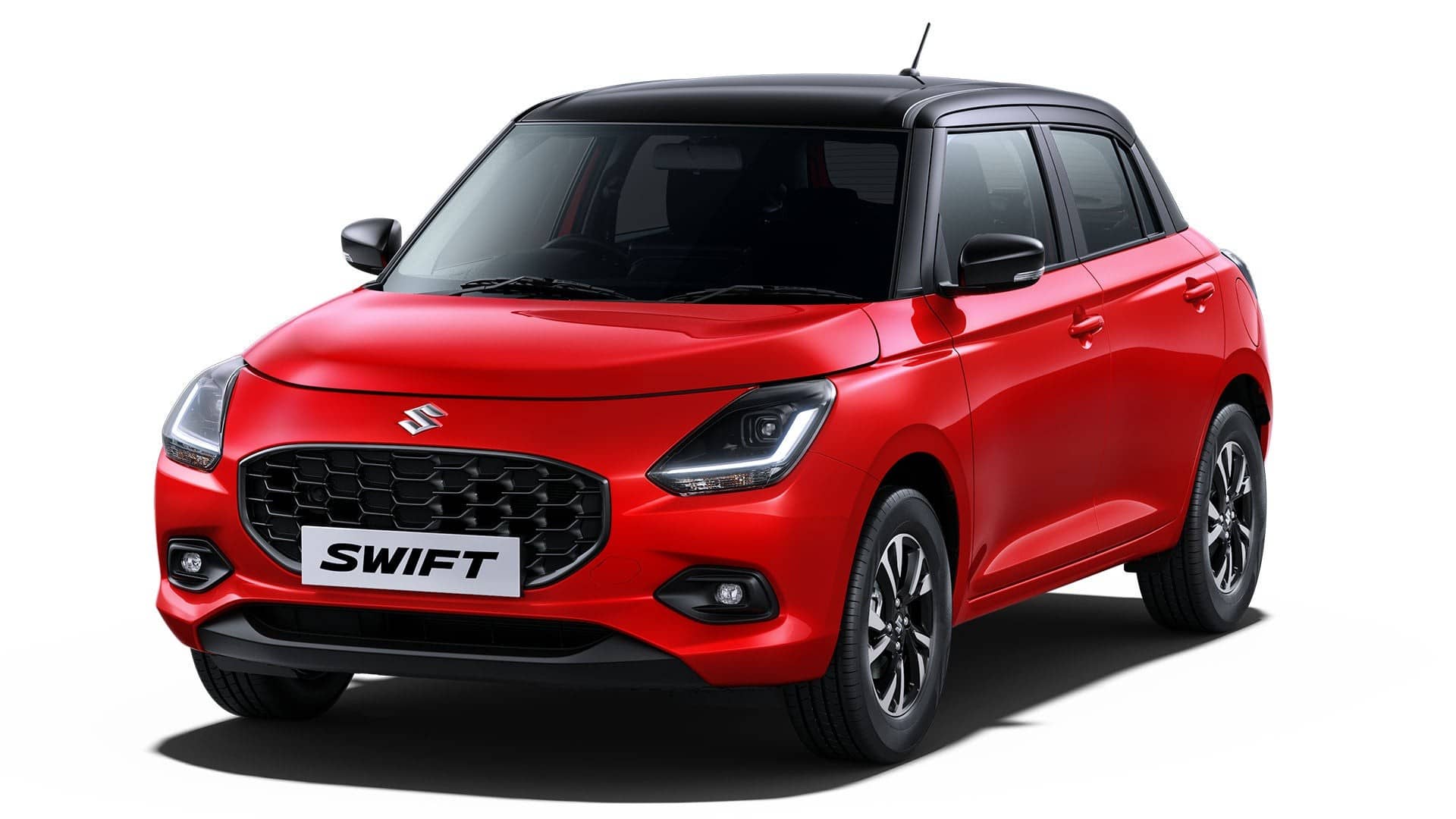 Red Maruti Suzuki Swift with black roof, front three-quarter view