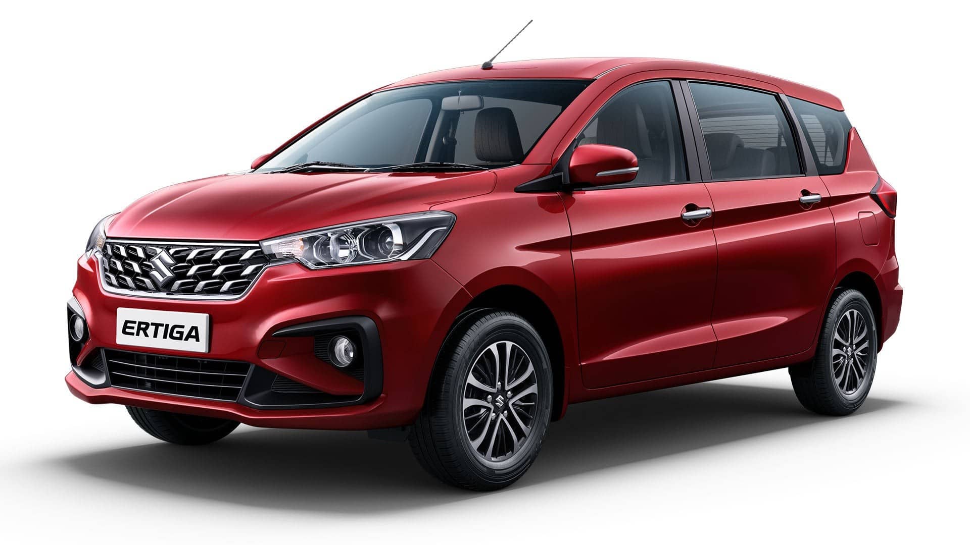 Red Maruti Suzuki Ertiga MPV, front three-quarter view