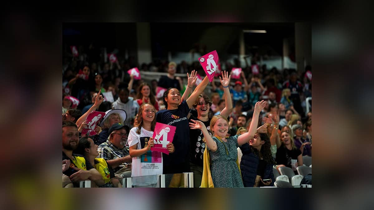 Spectators celebrate a boundary at Lord's cricket ground in an official MCC photograph.