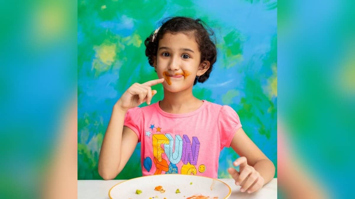 A child eats at a table in an official Troovy promotional photograph for its packaged food business.